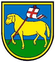 Das Wappen der Gemeinde Machtolsheim zeigt ein gelbes Lamm, das mit einer weißen Fahne, die ein rotes Kreuz trägt,  auf grünem Boden vor blauem Himmel steht, umgeben von einem gelben Schildrand.